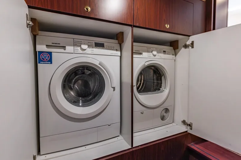 San Gottardo Yacht Photos Pics Laundry appliances in wooden cabinet on 2009 Altena Expedition yacht.
