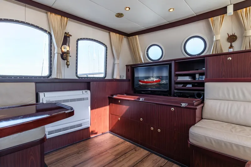 San Gottardo Yacht Photos Pics Luxurious interior of 2009 Altena Expedition yacht with wood paneling and modern amenities.