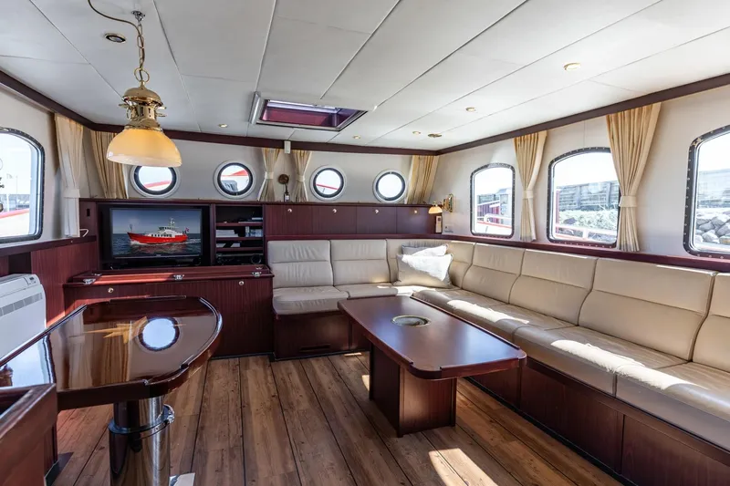 San Gottardo Yacht Photos Pics Luxurious 2009 Altena Expedition yacht interior with elegant seating and wooden accents.