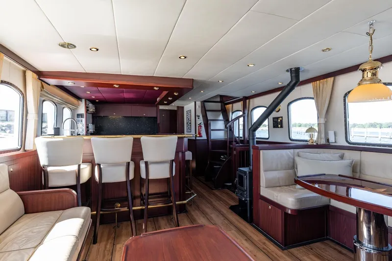 San Gottardo Yacht Photos Pics Luxurious 2009 Altena Expedition yacht interior with elegant seating and modern kitchen area.