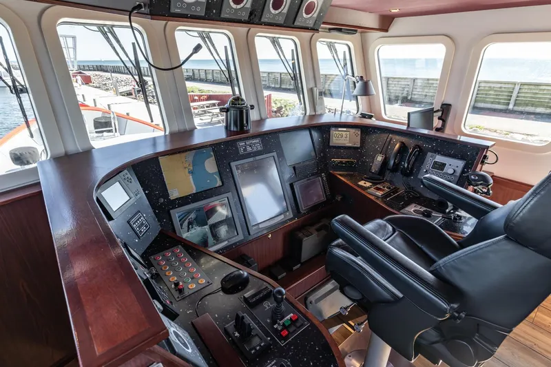 San Gottardo Yacht Photos Pics Control room of 2009 Altena Expedition yacht with navigation equipment and captain's chair.