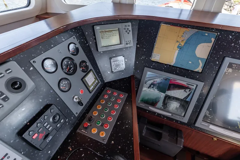 San Gottardo Yacht Photos Pics Control panel of 2009 Altena Expedition boat with navigation screens and gauges.