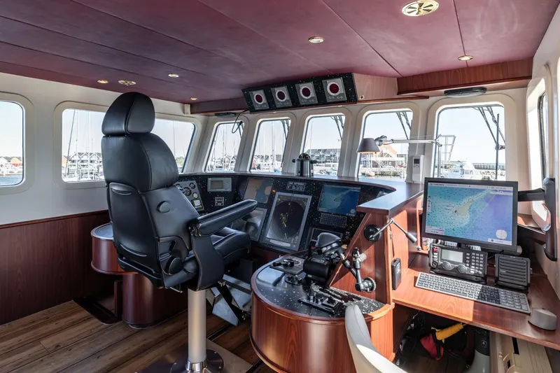 San Gottardo Yacht Photos Pics Luxurious 2009 Altena Expedition yacht cockpit with advanced navigation systems and comfortable seating.