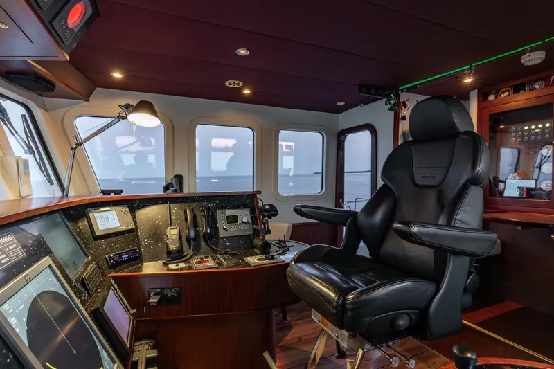 San Gottardo Yacht Photos Pics Luxurious 2009 Altena Expedition yacht cockpit with advanced navigation equipment and comfortable seating.