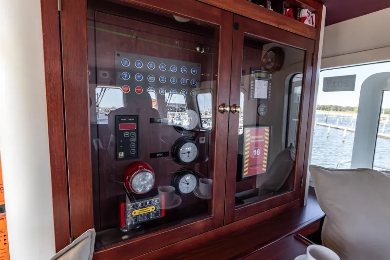 San Gottardo Yacht Photos Pics Control panel inside 2009 Altena Expedition yacht, featuring gauges and emergency instructions.