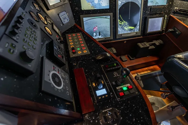 San Gottardo Yacht Photos Pics Control panel of 2009 Altena Expedition yacht with navigation screens and instruments.