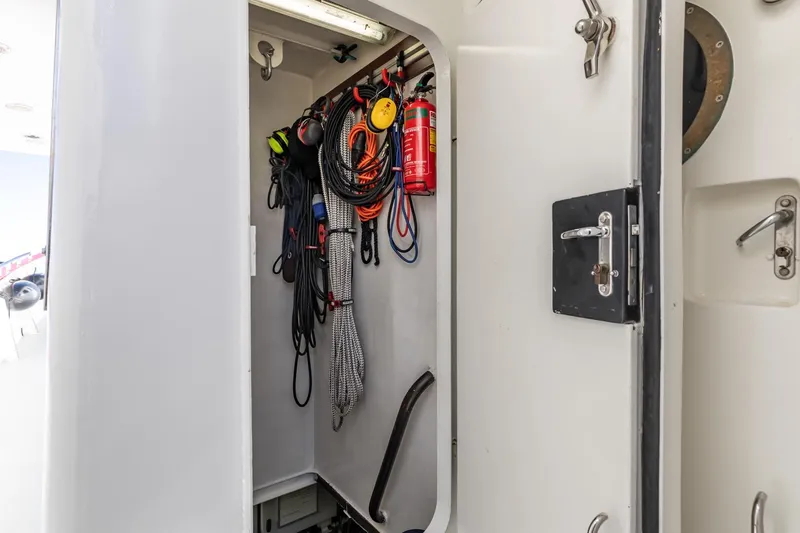 San Gottardo Yacht Photos Pics Storage compartment on 2009 Altena Expedition boat with ropes and fire extinguisher.