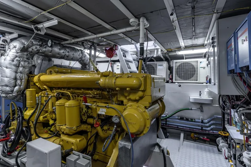 San Gottardo Yacht Photos Pics Engine room of 2009 Altena Expedition yacht with yellow machinery and ventilation system.