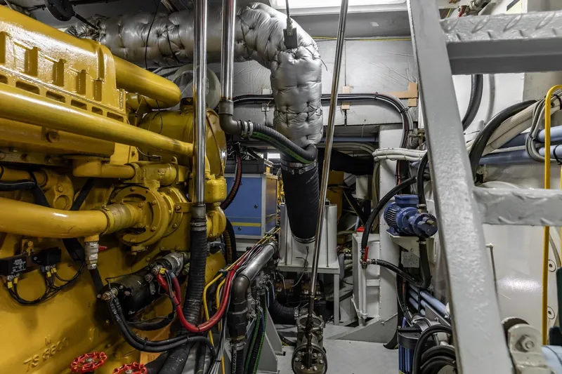 San Gottardo Yacht Photos Pics Engine room of 2009 Altena Expedition yacht with complex machinery and piping.