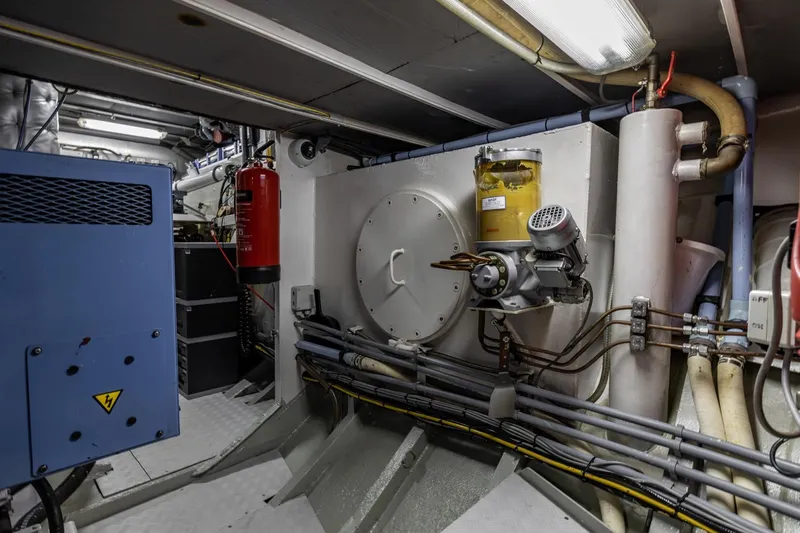 San Gottardo Yacht Photos Pics Engine room of 2009 Altena Expedition yacht with machinery and fire extinguisher.