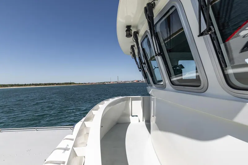 San Gottardo Yacht Photos Pics 2009 Altena Expedition yacht deck with ocean view and clear blue sky.