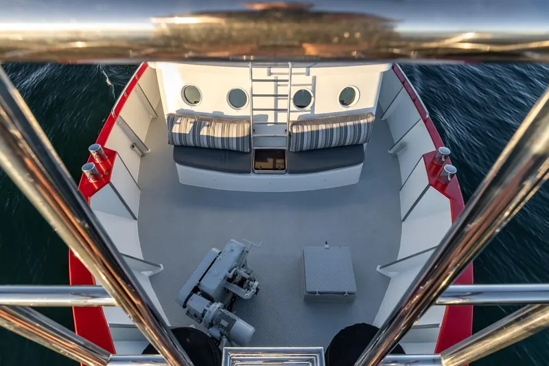 San Gottardo Yacht Photos Pics Bow view of 2009 Altena Expedition yacht with red accents and seating area.