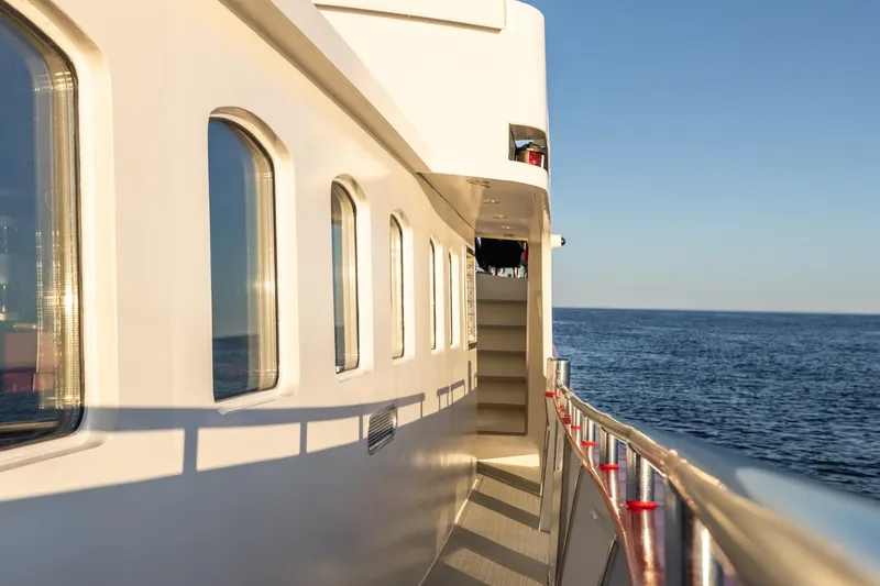 San Gottardo Yacht Photos Pics 2009 Altena Expedition yacht deck with ocean view and clear blue sky.