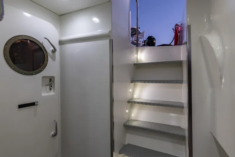 San Gottardo Yacht Photos Pics Interior of 2009 Altena Expedition yacht with stairs and porthole window.