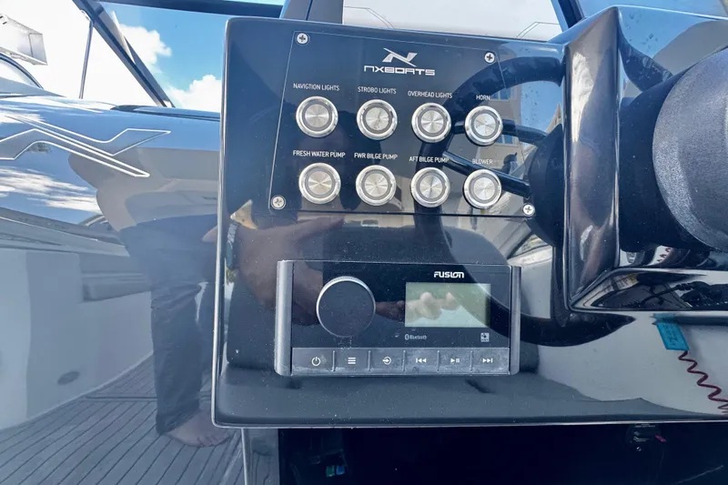  Yacht Photos Pics Control panel of 2024 NX Boats NX 280 with navigation and audio system.