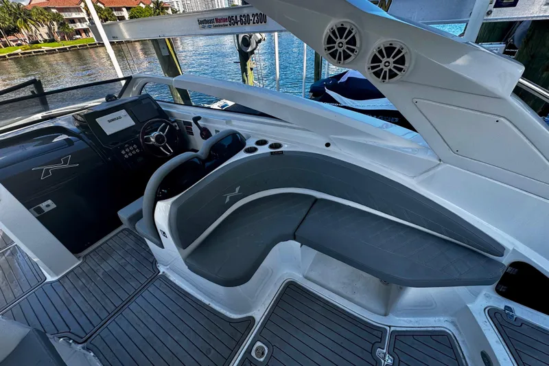  Yacht Photos Pics 2024 NX Boats NX 280 interior with sleek seating and modern dashboard design.