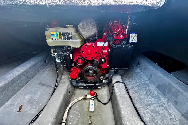 Yacht Photos Pics Engine compartment of 2024 NX Boats NX 280, showcasing a red marine engine.