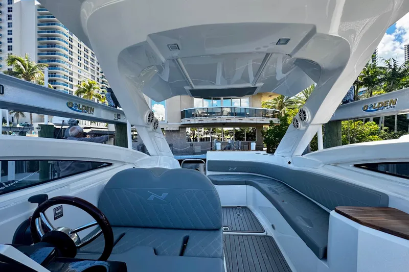  Yacht Photos Pics 2024 NX Boats NX 280 interior with modern design, docked near luxury buildings.