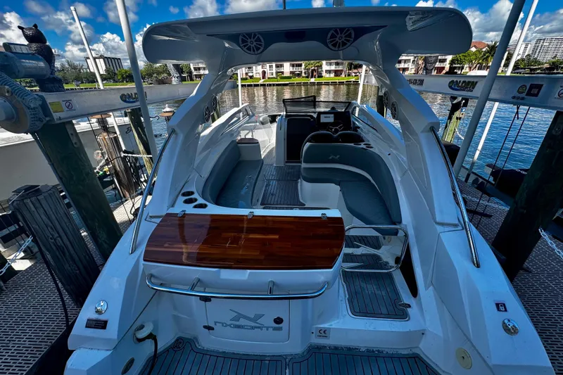  Yacht Photos Pics 2024 NX Boats NX 280 docked, showcasing sleek design and luxurious interior.