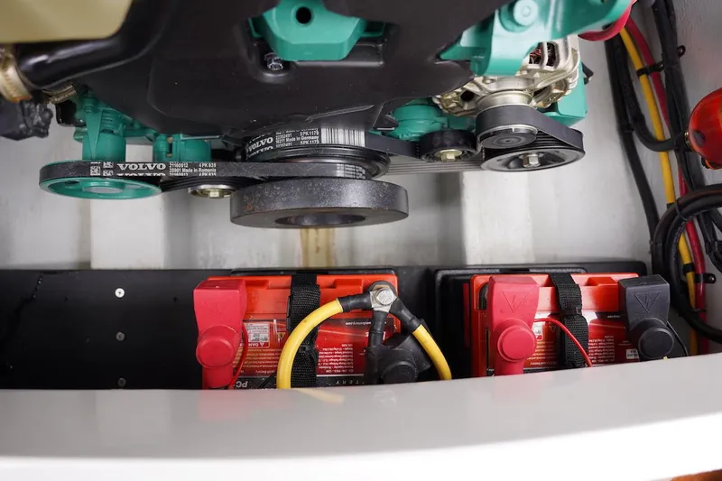 Tender 2 Yacht Photos Pics Engine compartment of a 2020 Novurania Chase boat with visible batteries and belts.