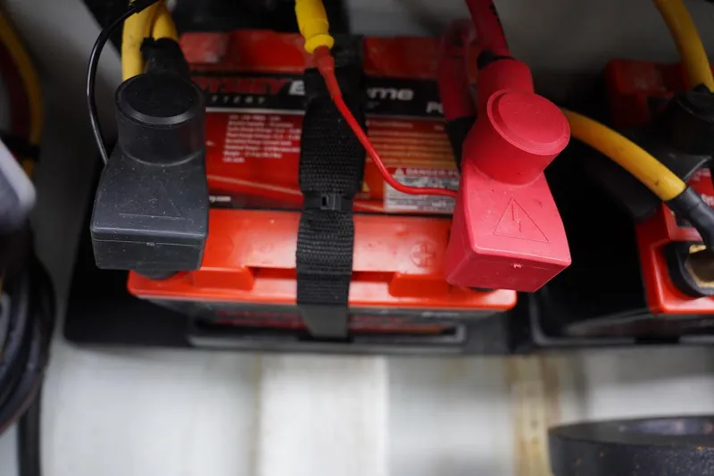 Tender 2 Yacht Photos Pics Battery setup in a 2020 Novurania Chase boat, featuring red and black terminals.
