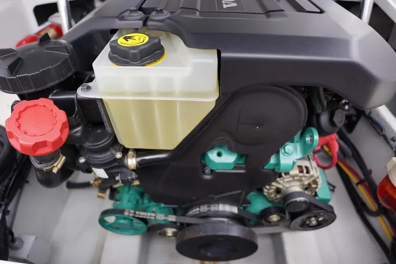 Tender 2 Yacht Photos Pics Engine compartment of a 2020 Novurania Chase boat, showcasing detailed components and fluid reservoirs.