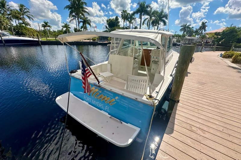  Yacht Photos Pics 2006 Back Cove 29 boat docked in Fort Myers, Florida, under a sunny sky.
