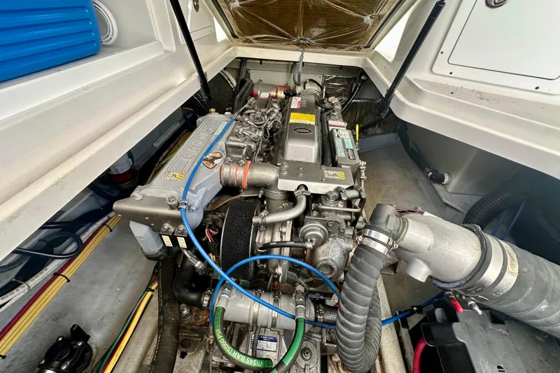  Yacht Photos Pics Engine compartment of a 2006 Back Cove 29 boat, showcasing detailed mechanical components.