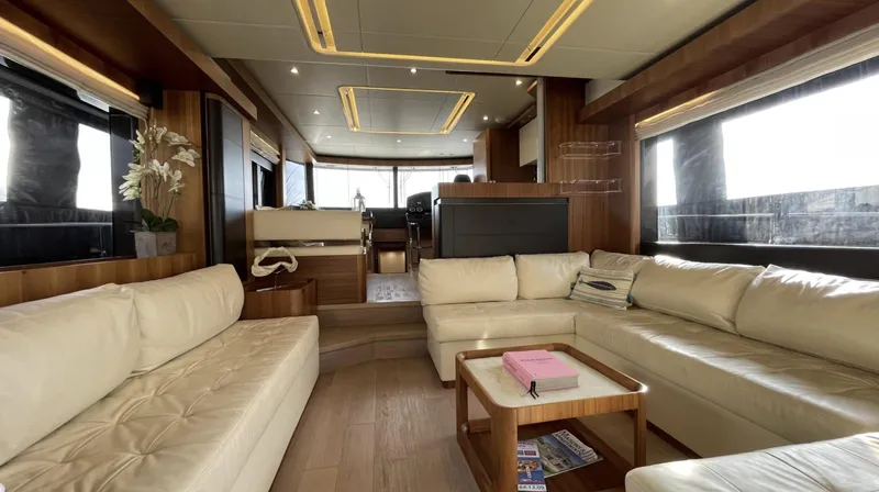 Grace Yacht Photos Pics Luxurious interior of 2016 Absolute NAVETTA 58 yacht with cream leather seating and wooden accents.