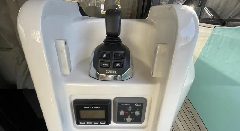 Grace Yacht Photos Pics Control panel of 2016 Absolute NAVETTA 58 yacht with joystick and display.