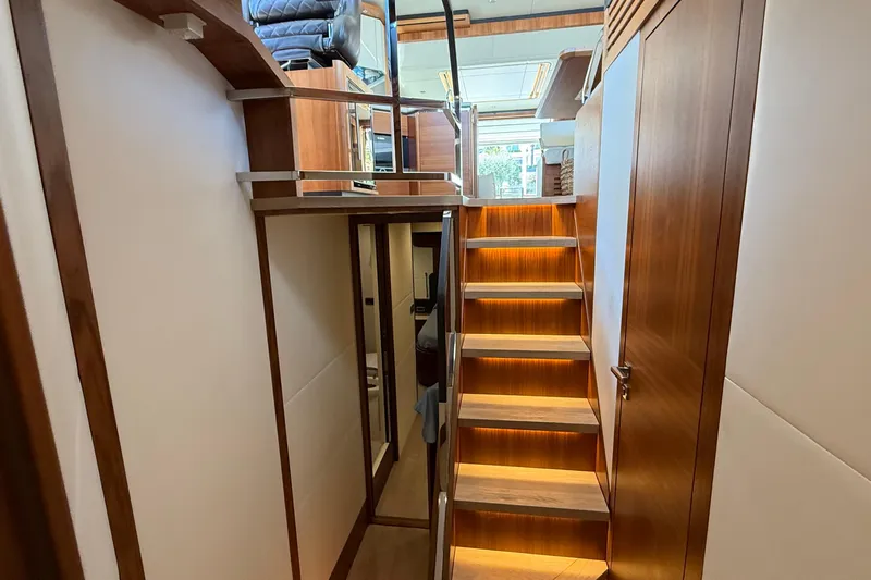 Grace Yacht Photos Pics Interior of 2016 Absolute NAVETTA 58 yacht with wooden stairs and modern design.