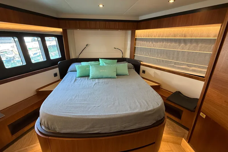 Grace Yacht Photos Pics Luxurious bedroom interior of 2016 Absolute NAVETTA 58 yacht with modern design and cozy bedding.