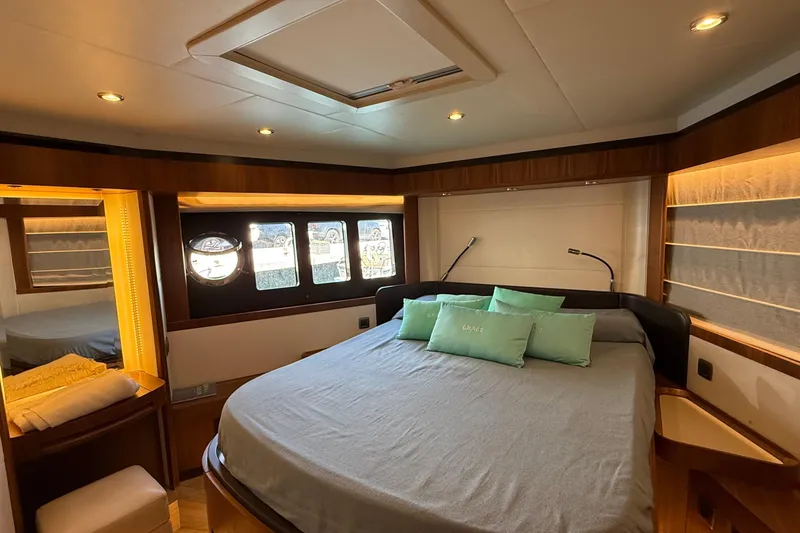 Grace Yacht Photos Pics Luxurious bedroom interior of 2016 Absolute NAVETTA 58 yacht with elegant wood finishes.