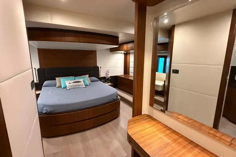 Grace Yacht Photos Pics Luxurious bedroom interior of 2016 Absolute NAVETTA 58 yacht with modern wood finishes.