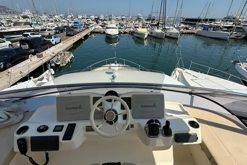 Grace Yacht Photos Pics Cockpit view of 2016 Absolute NAVETTA 58 yacht at marina with Garmin navigation.