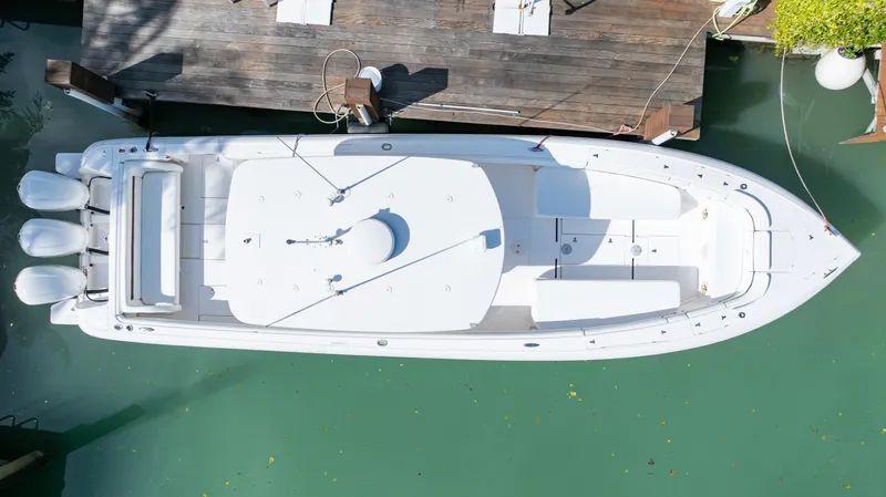  Yacht Photos Pics Aerial view of 2012 Intrepid 400 Center Console boat docked in clear water.