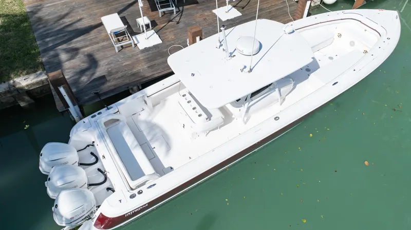  Yacht Photos Pics 2012 Intrepid 400 Center Console boat docked in turquoise water.