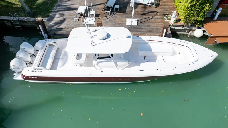  Yacht Photos Pics 2012 Intrepid 400 Center Console boat docked in clear water, aerial view.
