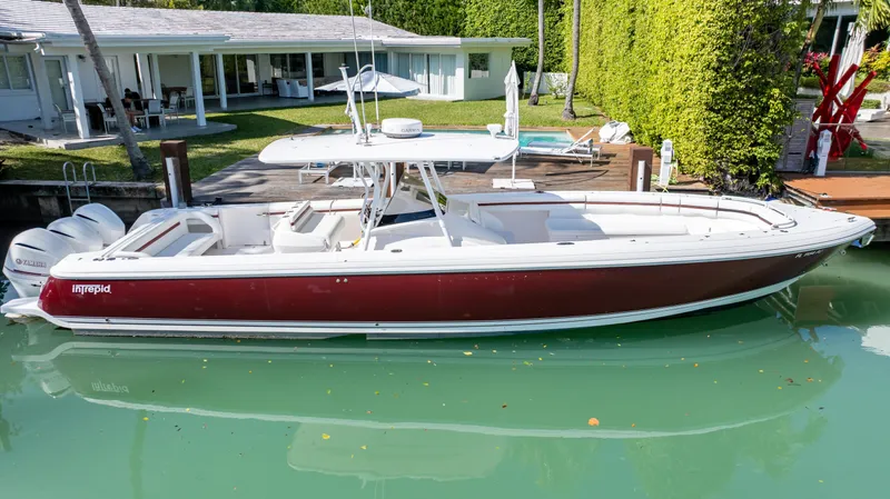  Yacht Photos Pics 2012 Intrepid 400 Center Console boat docked in a serene waterfront setting.