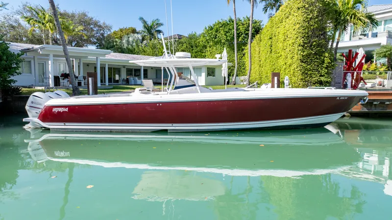  Yacht Photos Pics 2012 Intrepid 400 Center Console boat docked by waterfront home.