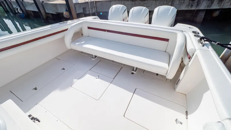  Yacht Photos Pics 2012 Intrepid 400 Center Console boat interior with white seating and storage compartments.