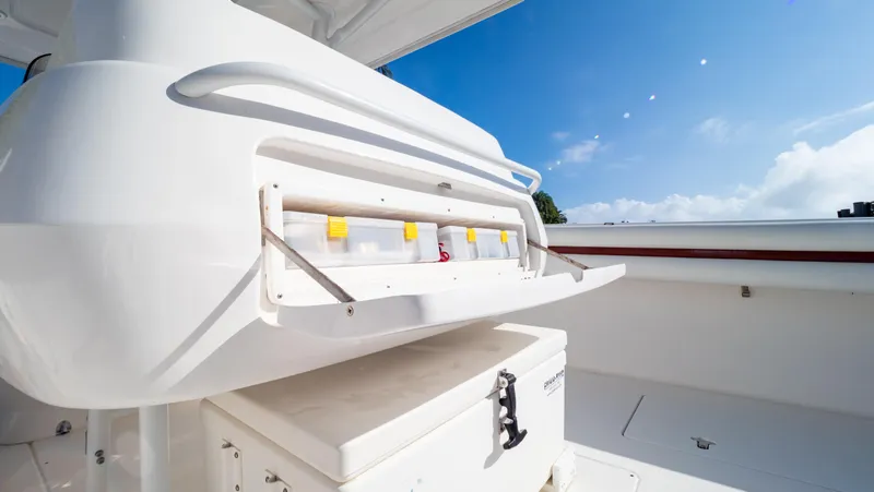  Yacht Photos Pics 2012 Intrepid 400 Center Console boat interior with storage compartment under clear blue sky.