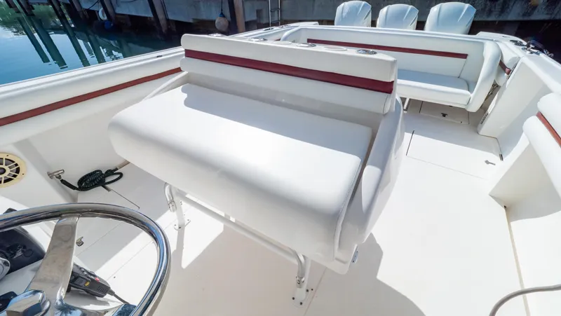  Yacht Photos Pics 2012 Intrepid 400 Center Console boat interior with white seating and steering wheel.
