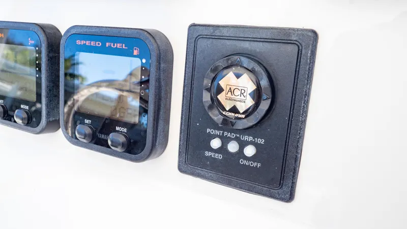  Yacht Photos Pics Control panel of a 2012 Intrepid 400 Center Console boat, featuring speed and fuel gauges.