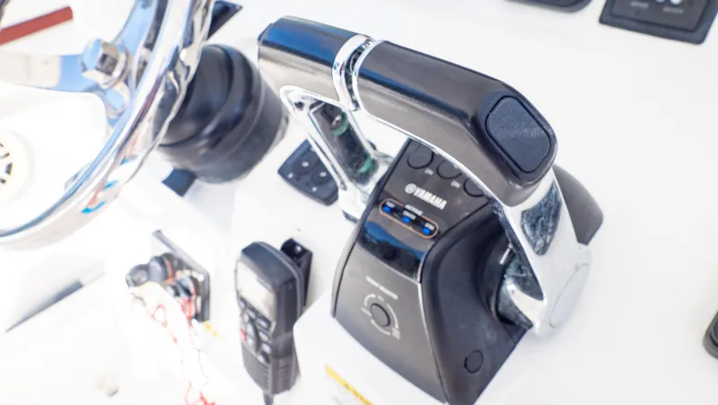  Yacht Photos Pics Close-up of 2012 Intrepid 400 Center Console boat controls and steering wheel.