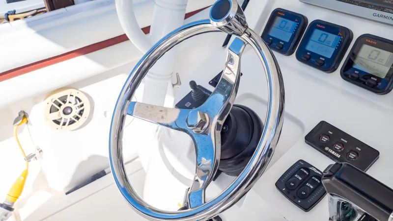  Yacht Photos Pics Steering wheel and controls of 2012 Intrepid 400 Center Console boat.