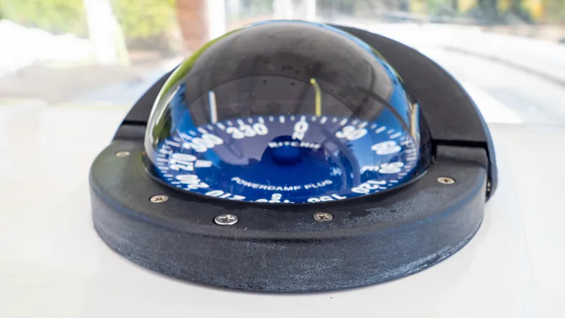  Yacht Photos Pics Close-up of a compass on a 2012 Intrepid 400 Center Console boat.