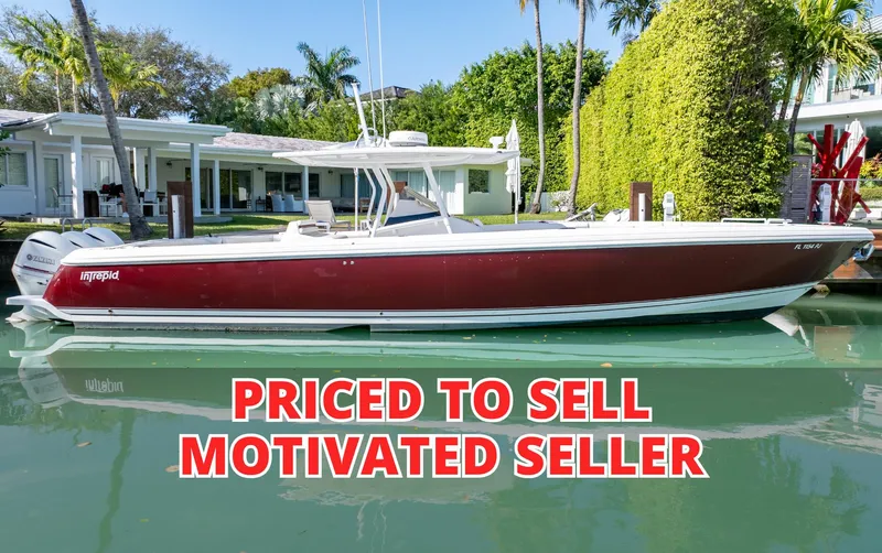  Yacht Photos Pics 2012 Intrepid 400 Center Console boat, red hull, docked, "Priced to Sell" text overlay.
