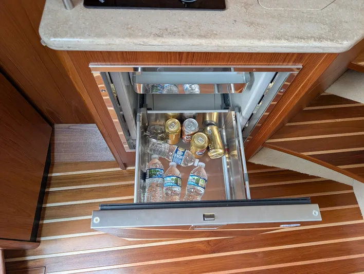 Finale Yacht Photos Pics Drawer fridge with drinks on Tiara Yachts 3100 Open, 2015 model, wooden flooring.