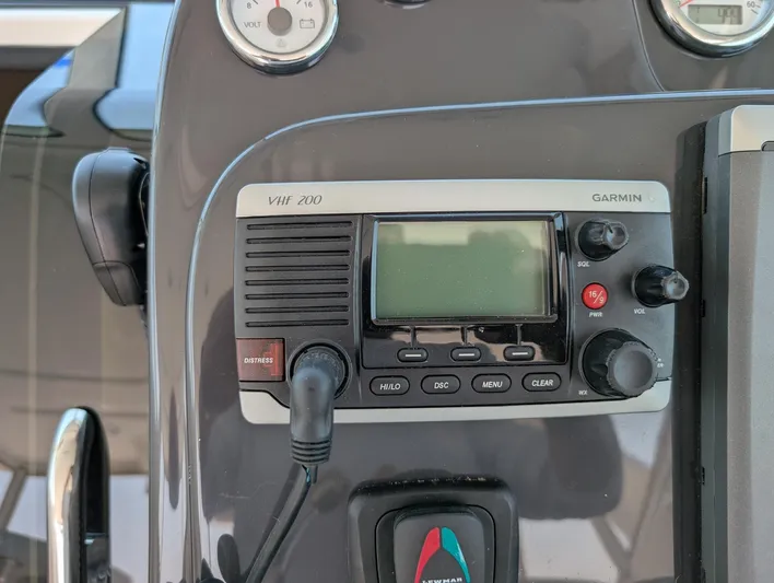 Finale Yacht Photos Pics Control panel of a 2015 Tiara Yachts 3100 Open with Garmin VHF 200 radio.